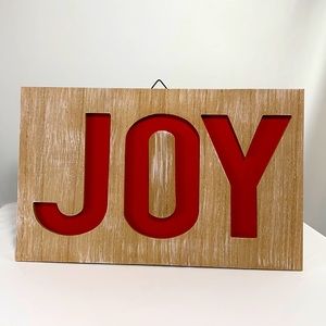 JOY wall decor in faux distressed wood finish with red lettering